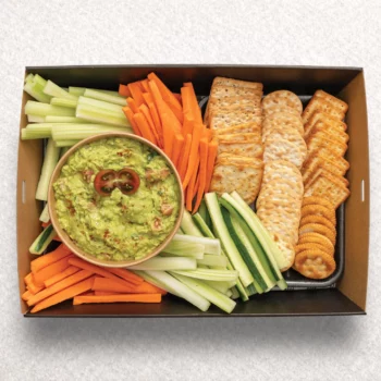 Guacamole dip with veggie stick sand crackers