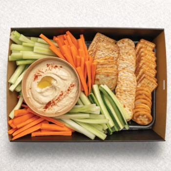 Hummus dip with veggie stick sand crackers